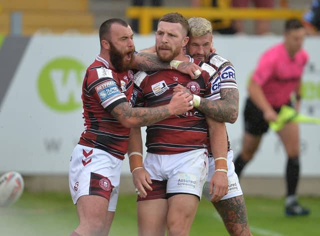 Jake Bibby and Zak Hardaker congratulate Jackson Hastings after his try at Castleford