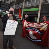 Protestors in Wigan town centre yesterday
