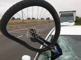 The bike embedded in the car