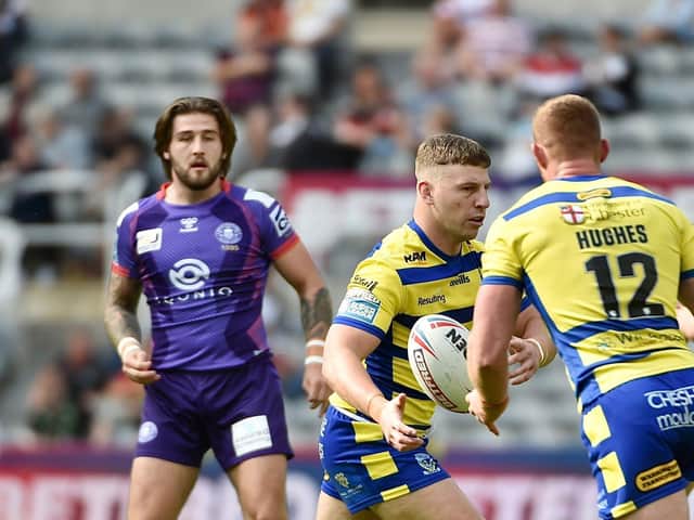 Joe Shorrocks watches the ball as George Williams passes to another ex-Warrior, Jack Hughes