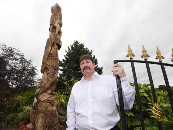 Edward Blagbrough next to his totem pole