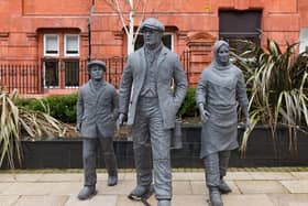 The statues are near Wigan Town Hall