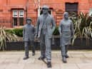 The statues are near Wigan Town Hall