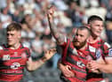 Jake Bibby is congratulated on his try