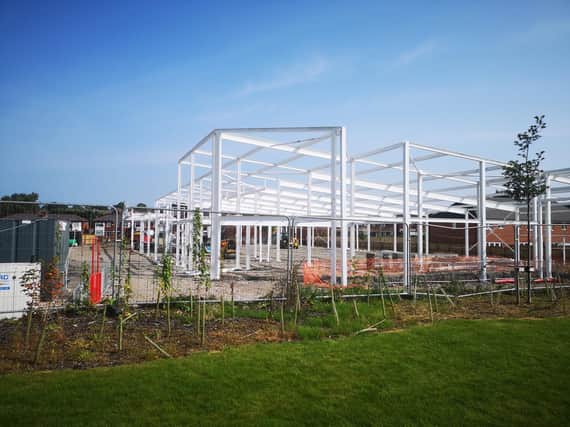 The framework for the new Lidl store on Woodhouse Lane is up