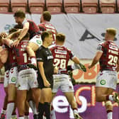 Wigan players celebrate Willie Isa's first-half try