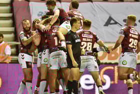 Wigan players celebrate Willie Isa's first-half try