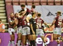 Wigan players celebrate Willie Isa's first-half try