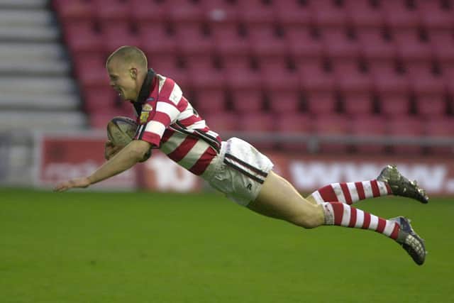 Kevin Brown flies over for a Wigan try