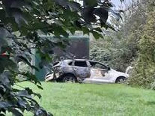 The burnt out car next to the monitoring station