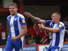 Charlie Wyke celebrates with ex-Sunderland team-mate Max Power