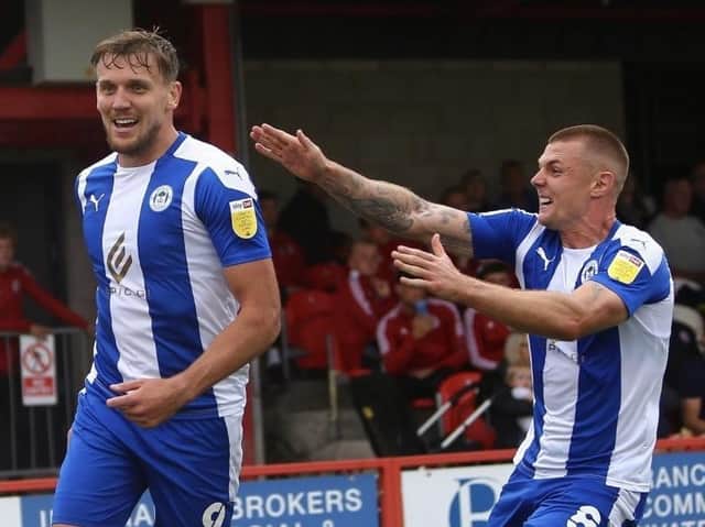 Charlie Wyke celebrates with ex-Sunderland team-mate Max Power