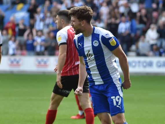 Callum Lang celebrates opening the scoring