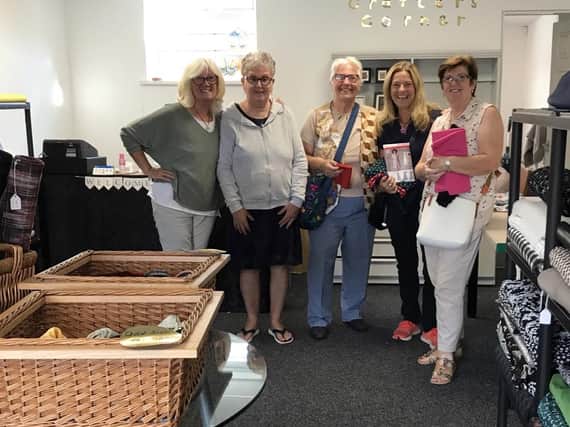 Louise (far left) and Caroline (centre right) with customers in Crafters Corner