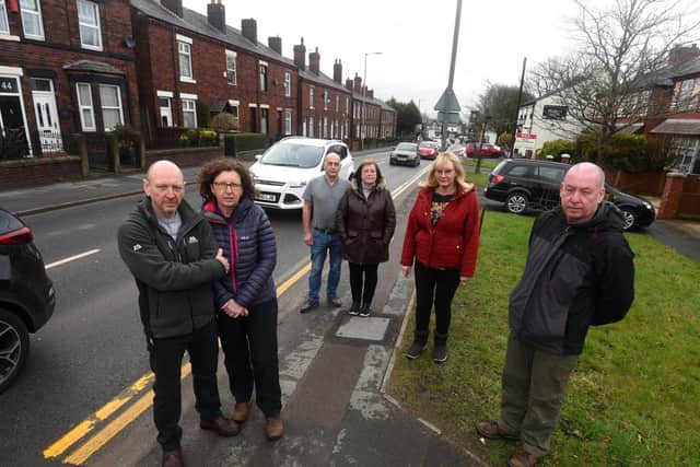 Left to right: Unhappy School Lane residents Ian and Julie Parkes, Tim and Janet McAvoy, Audrey Lowe and Eric Lloyd are against the road-widening plan