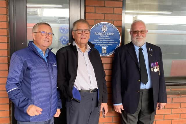 Ray Moores, Paul Moores and David Kuester with the plaque for their great-grandfather Det Sgt Robert Kidd