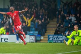 Tendayi Darikwa celebrates at Gillingham