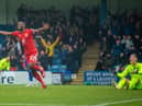 Tendayi Darikwa celebrates at Gillingham