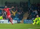 Tendayi Darikwa celebrates at Gillingham