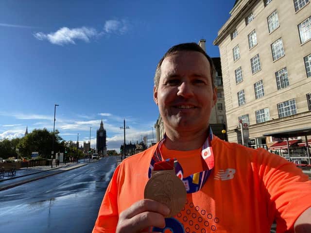 Chris Green celebrates with his medal