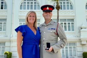 Lee Arnold and wife Roseann with the medal