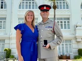 Lee Arnold and wife Roseann with the medal