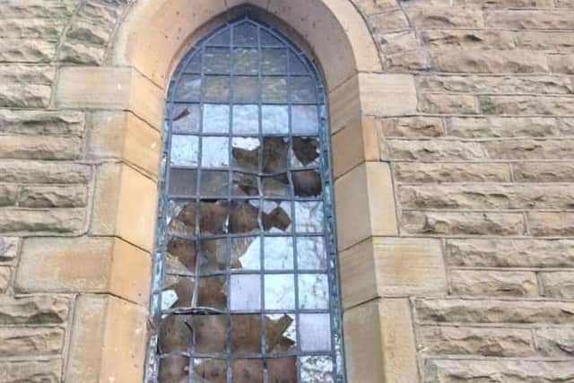 A broken window at the church