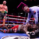 Tyson Fury (top) knocks out Deontay Wilder in the 11th round (photo: Getty Images)
