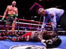 Tyson Fury (top) knocks out Deontay Wilder in the 11th round (photo: Getty Images)