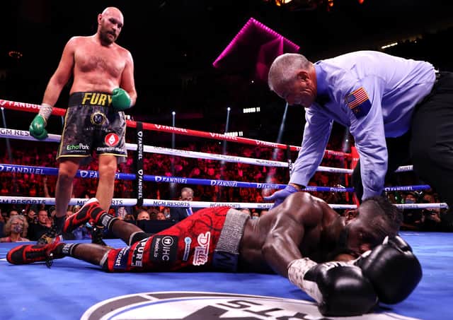 Tyson Fury (top) knocks out Deontay Wilder in the 11th round (photo: Getty Images)