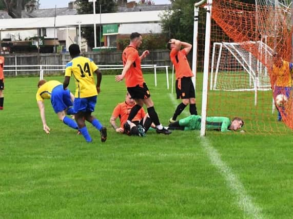 Billinge force the ball home against Daten (Pic: Terry Pope)