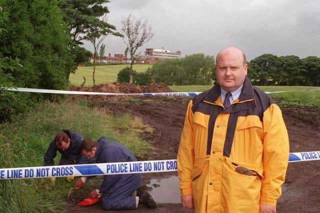 Det Supt Ian Seabridge with the forensic team conducting a fingertip search of the Louise Sellars murder scene with Billinge Hospital in the backgound