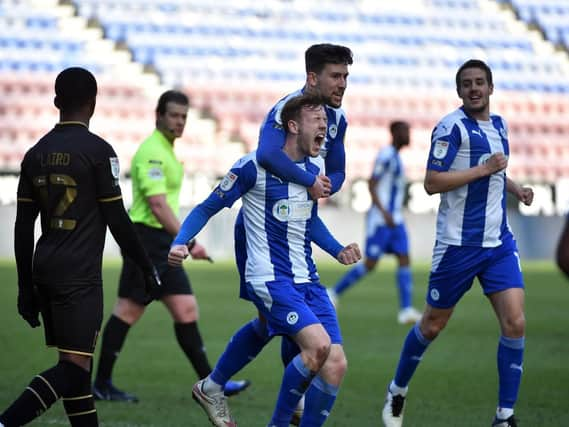 George Johnston in action for Latics last term