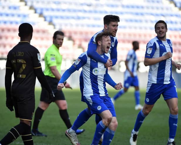 George Johnston in action for Latics last term