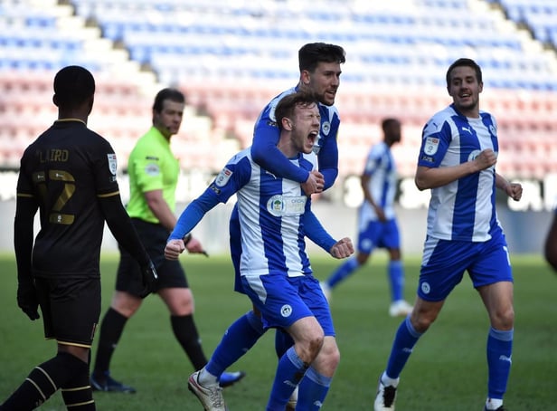 George Johnston in action for Latics last term