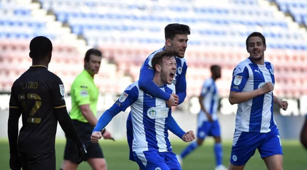 George Johnston in action for Latics last term