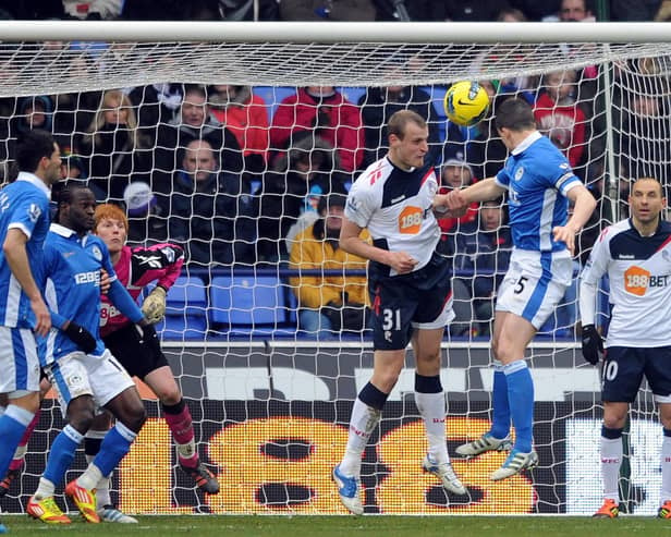 Gary Caldwell heads past Adam Bogdan to give Latics the lead at Bolton in February 2012