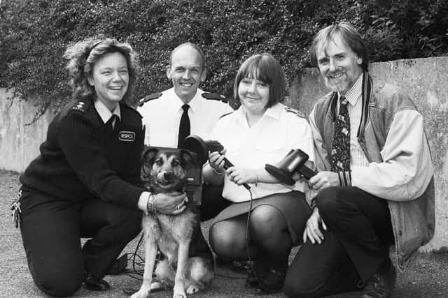 Richard Weston (right) presenting dog-chipping equipment to the RSPCA in 1995