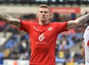 James McClean celebrates scoring his second and Latics' fourth goal at Bolton