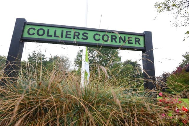 A sign for Colliers Corner which has received Green Flag status