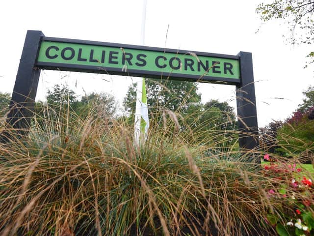 A sign for Colliers Corner which has received Green Flag status