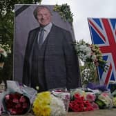 A UK Iranian Community vigil and shrine for Sir David Amess in Parliament Square