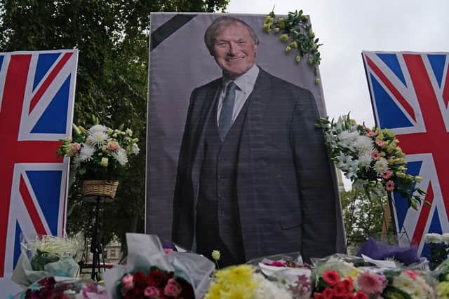 A UK Iranian Community vigil and shrine for Sir David Amess in Parliament Square