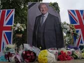 A UK Iranian Community vigil and shrine for Sir David Amess in Parliament Square