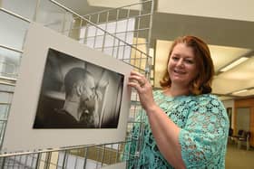 Photographer Petro Bekker at the opening of her exhibtion, Behind Closed Doors, photography exhibition by Petro Bekker, documenting the height of Covid in Wigan hospitals, on display at Wigan Life Centre until 5th November 2021.