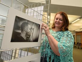 Photographer Petro Bekker at the opening of her exhibtion, Behind Closed Doors, photography exhibition by Petro Bekker, documenting the height of Covid in Wigan hospitals, on display at Wigan Life Centre until 5th November 2021.