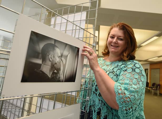 Photographer Petro Bekker at the opening of her exhibtion, Behind Closed Doors, photography exhibition by Petro Bekker, documenting the height of Covid in Wigan hospitals, on display at Wigan Life Centre until 5th November 2021.
