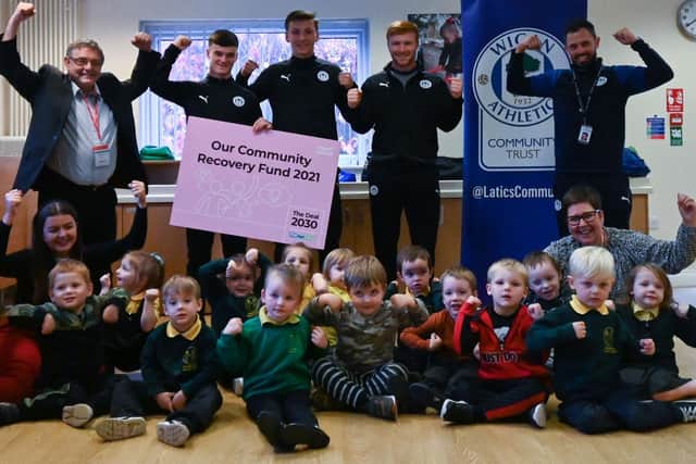 Latics players Owen Mooney, Adam Brooks and Arthur Lomax attended the relaunch at Douglas Valley Nursery