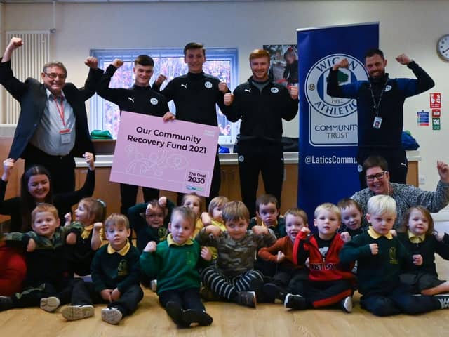 Latics players Owen Mooney, Adam Brooks and Arthur Lomax attended the relaunch at Douglas Valley Nursery