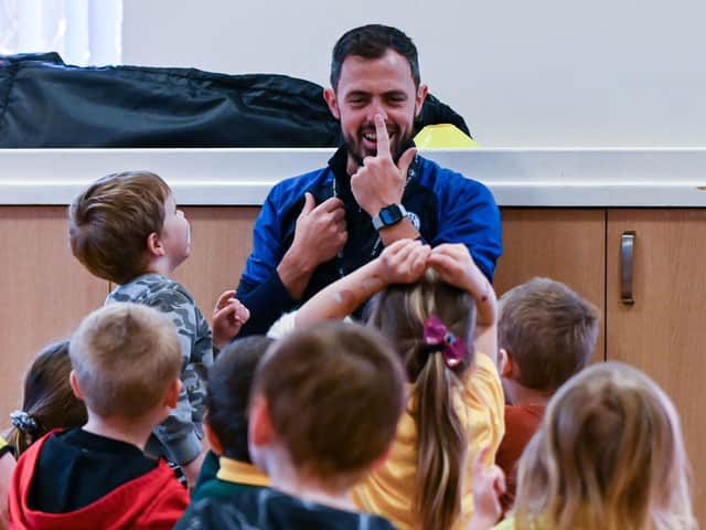 Latics players engaging with children at Douglas Valley nursery